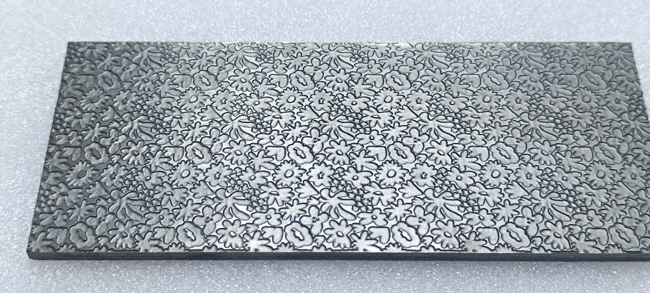Close-up of floral engraving in a texture plate