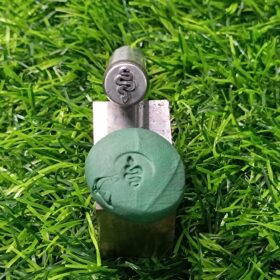 Snake design metal stamp and its sample impression on green material