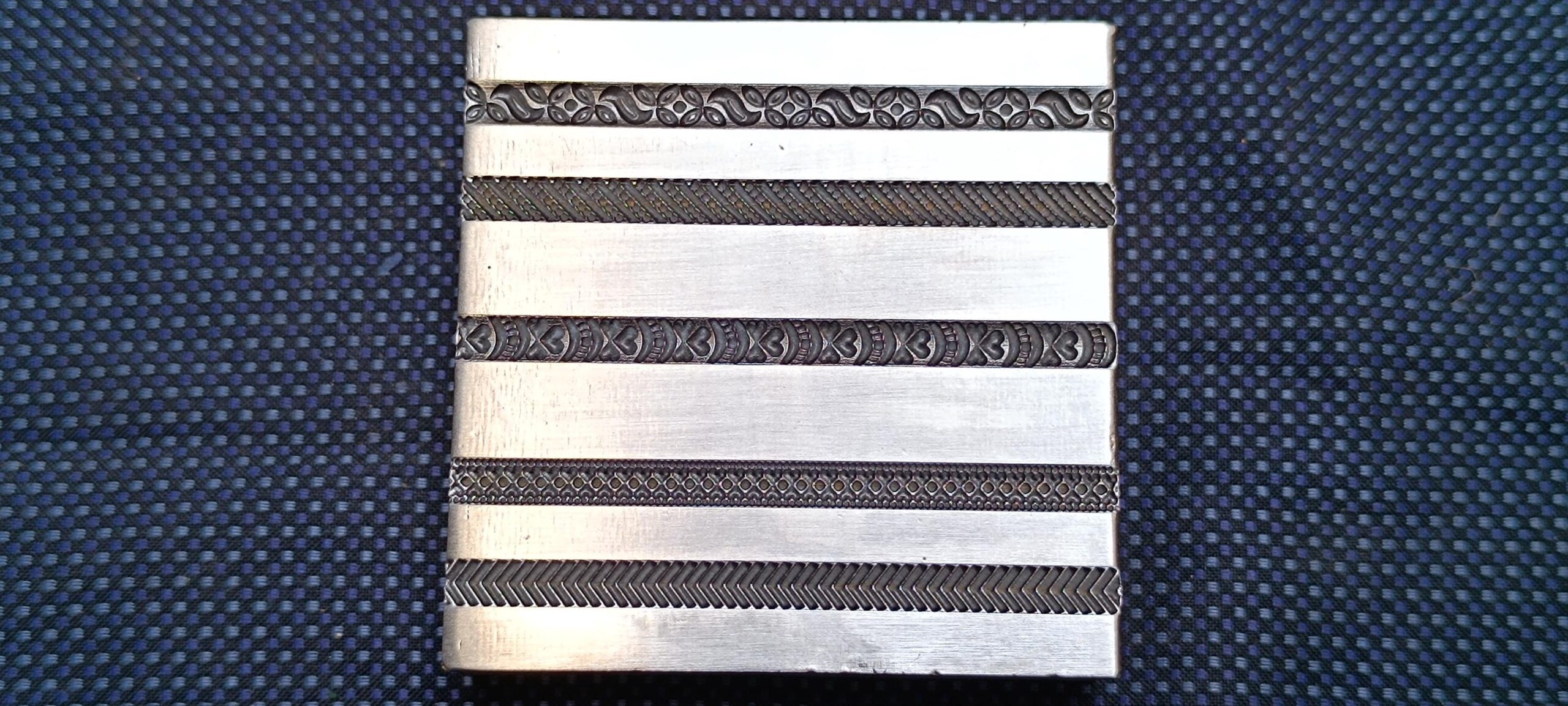 il_fullxfull.7030650683_sujw.jpg BW32 bangle wire die with scroll and chevron pattern grooves
